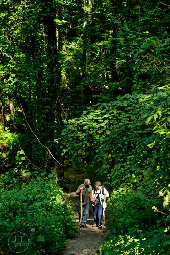 Domenic Antonelli (left) and his wife Jana walk the trail up to the waterfall at Amicalola State Park in Dawsonville on Tuesday, September 23, 2014. 