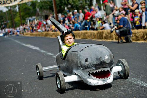 Henry Manso steers his shark down Madison Ave. in Decatur during the 4th annual Madison Ave. Soap Box Derby on Saturday, September 27, 2014.