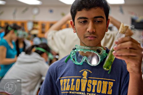 Sanket Mehta works on a lab during his biology class at Walton High School on Tuesday, October 14, 2014. 