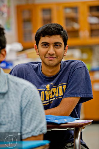 Sanket Mehta takes notes during his biology class at Walton High School on Tuesday, October 14, 2014. 