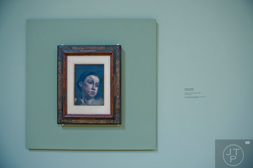 Gustave Courbet's Portrait of a Young Woman sits on display in the High Museum of Art's new "Cezanne and the Modern: Masterpieces of European Art from the Pearlman Collection" exhibit on Tuesday, October 14, 2014.  