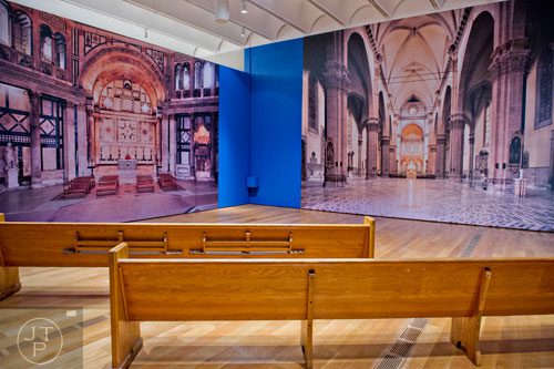 Church pews and photos taken inside Florence Cathedral sit on display in the High Museum of Art's new "Make a Joyful Noise": Renaissance Art and Music at Florence Cathedral exhibit on Tuesday, October 14, 2014.   