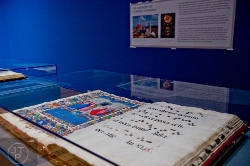 Dedication of Florence Cathedral, the ink, tempera and gold leaf on parchment piece by Francesco di Antonio del Chierico, sits on display in the High Museum of Art's new "Make a Joyful Noise": Renaissance Art and Music at Florence Cathedral exhibit on Tuesday, October 14, 2014.  