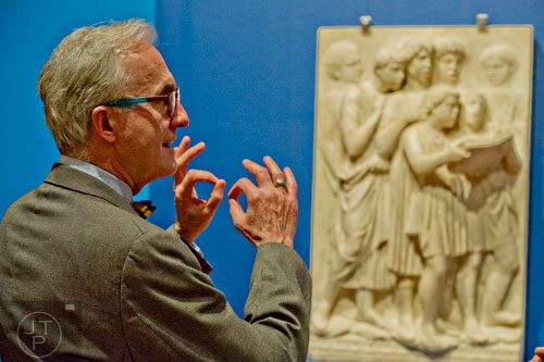 Gary Radke discusses one of three marble panels from Italian sculptor Luca della Robbia's famed organ loft created for Florence Cathedral on display in the High Museum of Art's new "Make a Joyful Noise": Renaissance Art and Music at Florence Cathedral exhibit on Tuesday, October 14, 2014.  