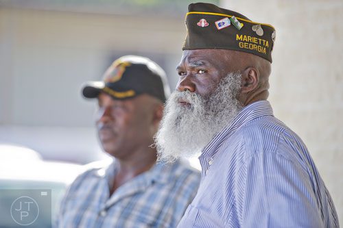 Saleem Khaleel (right) and Olson Stapleton wait for the arrival of  Republican candidate David Perdue and senators John McCain and Johnny Isakson who spoke to a crowd of supporters at the VFW Post 2681 in Marietta on Wednesday, October 15, 2014. 