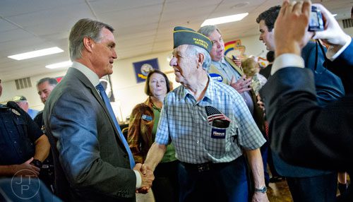 Republican candidate David Perdue (left) shakes hands with Richard Weber after speaking at the VFW Post 2681 in Marietta on Wednesday, October 15, 2014.