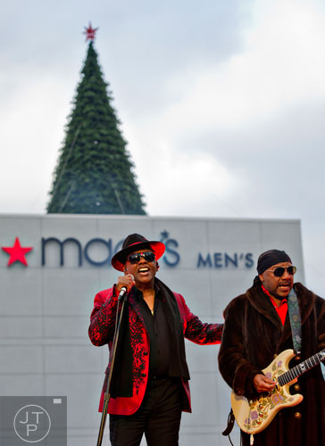 Ronald (left) and Ernie Isley, better known as The Isley Brothers, perform on stage during the annual Macy's Great Tree Lighting celebration at Lenox Square Mall in Atlanta on Thursday, November 27, 2014. 
