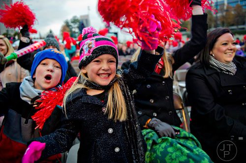 Natalie Hauert (center) cheers during the annual Macy's Great Tree Lighting celebration at Lenox Square Mall in Atlanta on Thursday, November 27, 2014. 