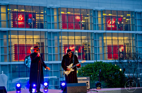 Ronald (left) and Ernie Isley, better known as The Isley Brothers, perform on stage during the annual Macy's Great Tree Lighting celebration at Lenox Square Mall in Atlanta on Thursday, November 27, 2014. 