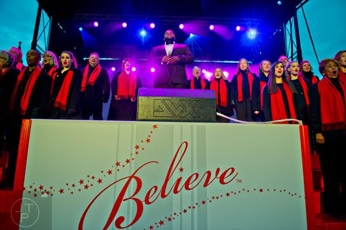 Timothy Miller (center) performs on stage with the Macy's All-Star Choir during the annual Macy's Great Tree Lighting celebration at Lenox Square Mall in Atlanta on Thursday, November 27, 2014. 