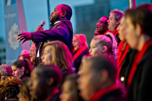 Timothy Miller (top left) performs on stage with the Macy's All-Star Choir during the annual Macy's Great Tree Lighting celebration at Lenox Square Mall in Atlanta on Thursday, November 27, 2014. 