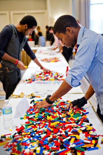 Rod Ferris (right) and Aries Viera sort their LEGO bricks during the LEGOLAND Discovery Center Atlanta's Brick Factor Competition at the Mandarin Oriental building in Atlanta on Sunday, November 23, 2014. 