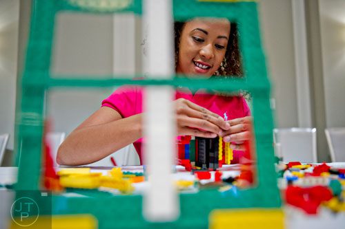 Chanel Nicholson builds a scultpure using LEGOs during the LEGOLAND Discovery Center Atlanta's Brick Factor Competition at the Mandarin Oriental building in Atlanta on Sunday, November 23, 2014. 