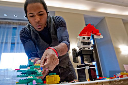 Aries Viera creates a scene from the movie "A Nightmare Before Christmas" using LEGOs during the LEGOLAND Discovery Center Atlanta's Brick Factor Competition at the Mandarin Oriental building in Atlanta on Sunday, November 23, 2014. 