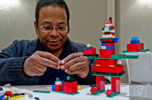Daryl Wilcher builds a sculpture from the movie "Elf" using LEGOs during the LEGOLAND Discovery Center Atlanta's Brick Factor Competition at the Mandarin Oriental building in Atlanta on Sunday, November 23, 2014. 