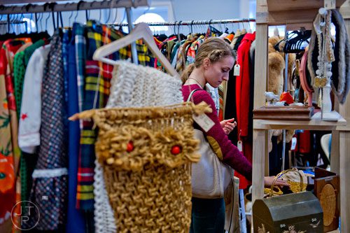 Jackie Nash shops in the Forgotten Feather Vintage booth during the 10th annual Indie Craft Experience Holiday Shopping Spectacular at the Georgia Freight Depot in Atlanta on Sunday, November 23, 2014. 
