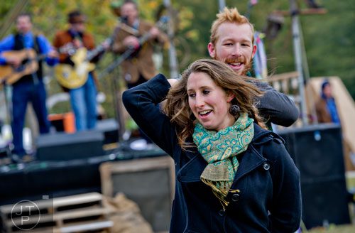 Olivia Gorbatkin (front) dances with Matt Taylor during the 12th annual Cabbagetown Chomp & Stomp in Atlanta on Saturday, November 1, 2014. 