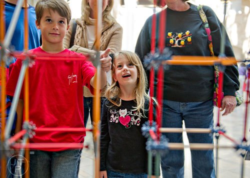 Ethan Crook (left) and Lily Anne Perry watch model buildings shake in a earthquake resistance experiment during Science at Hand at the Fernbank Museum of Natural History in Atlanta on Saturday, November 8, 2014. 