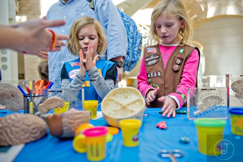 Ava Innes (left) and her sister Destiny create a brain using play-doh during Science at Hand at the Fernbank Museum of Natural History in Atlanta on Saturday, November 8, 2014. 