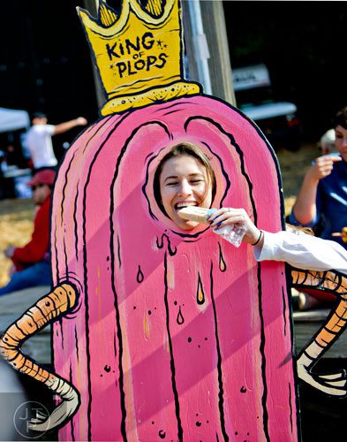 Ansley Stephenson eats a popsicle as she poses for a photo during the 4th annual King of Pops Field Day at The Masquerade in Atlanta on Saturday, November 8, 2014. 