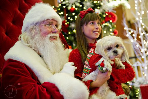 Bailey and her owner Katelyn Vetro take a photo with Santa at Town Center at Cobb in Kennesaw on Sunday, November 30, 2014.