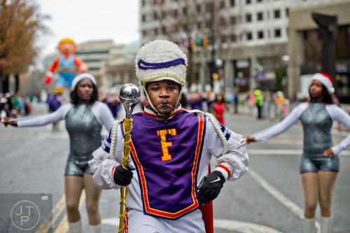 Fairfield High School drum major Nigel Kemp (center) leads his band down Peachtree St. during the 2014 Children's Christmas Parade in Atlanta on Saturday, December 6, 2014. 