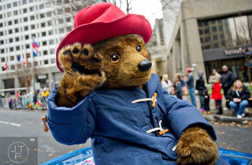 Paddington Bear waves to the crowd during the 2014 Children's Christmas Parade in Atlanta on Saturday, December 6, 2014. 