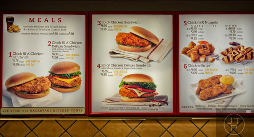 The menu board at the Chick-fil-A off of Camp Creek Parkway in East Point features calorie information due to a new FDA regulation on Wednesday, December 10, 2014.