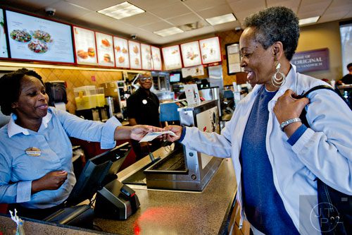 Samantha Victor (left) takes Josephine Williams' lunch order at the Chick-fil-A off of Camp Creek Parkway in East Point on Wednesday, December 10, 2014. 