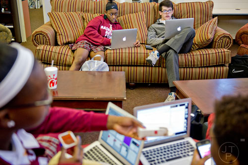 Shai Blanding (left) sits on a couch with Kyle Murdock as they study for final exams at Holy Innocents' Episcopal School in Atlanta on Friday, December 19, 2014. 