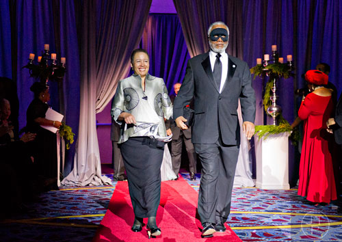 Dr. Beverly Tatum (left), president of Spelman College and her husband Travis are introduced during the 31st annual United Negro College Fund Mayor's Masked Ball at the Atlanta Marriott Marquis in downtown on Saturday, December 20, 2014.