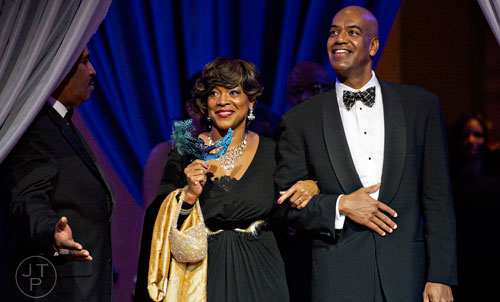 Dr. Valerie Montgomery Rice (center) and her husband Melvin are introduced during the 31st annual United Negro College Fund Mayor's Masked Ball at the Atlanta Marriott Marquis in downtown on Saturday, December 20, 2014. 