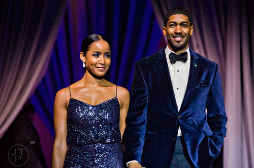 Faune Chambers Watkins (left) and her husband Derrick "Fonzworth Bentley" Watkins are introduced during the 31st annual United Negro College Fund Mayor's Masked Ball at the Atlanta Marriott Marquis in downtown on Saturday, December 20, 2014. 
