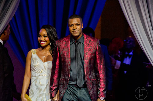 Chris Tucker (right) and Cynee Simpson are introduced during the 31st annual United Negro College Fund Mayor's Masked Ball at the Atlanta Marriott Marquis in downtown on Saturday, December 20, 2014.