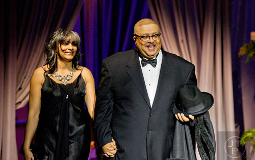 Ivory Young and his wife Shalise are introduced during the 31st annual United Negro College Fund Mayor's Masked Ball at the Atlanta Marriott Marquis in downtown on Saturday, December 20, 2014. 