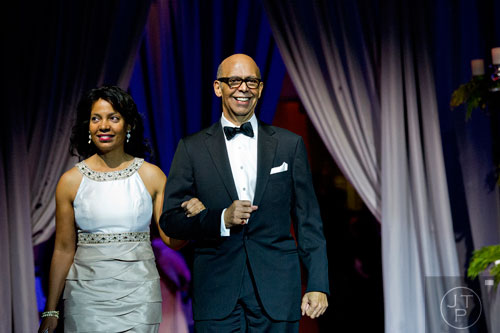 Dr. Michael Lomax (right) and his wife Cheryl are introduced during the 31st annual United Negro College Fund Mayor's Masked Ball at the Atlanta Marriott Marquis in downtown on Saturday, December 20, 2014. 