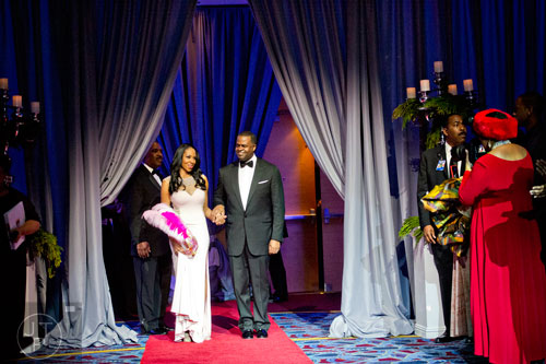 Atlanta mayor Kasin Reed (center) and his wife Sarah-Elizabeth are introduced during the 31st annual United Negro College Fund Mayor's Masked Ball at the Atlanta Marriott Marquis in downtown on Saturday, December 20, 2014. 