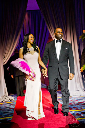 Atlanta mayor Kasin Reed (right) and his wife Sarah-Elizabeth are introduced during the 31st annual United Negro College Fund Mayor's Masked Ball at the Atlanta Marriott Marquis in downtown on Saturday, December 20, 2014. 