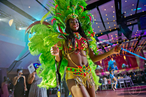 Celeste Marshall leads the Parade of Masks during the 31st annual United Negro College Fund Mayor's Masked Ball at the Atlanta Marriott Marquis in downtown on Saturday, December 20, 2014. 