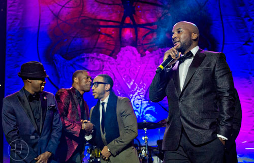 Young Jeezy (right) stands on stage with Will Packer (left), Chris Tucker and Ludacris during the 31st annual United Negro College Fund Mayor's Masked Ball at the Atlanta Marriott Marquis in downtown on Saturday, December 20, 2014. 