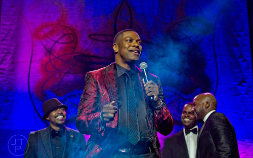 Chris Tucker (center) stands on stage with Will Packer (left), Atlanta mayor Kasin Reed and Young Jeezy during the 31st annual United Negro College Fund Mayor's Masked Ball at the Atlanta Marriott Marquis in downtown on Saturday, December 20, 2014.