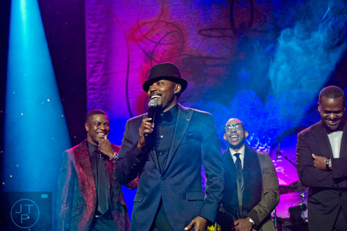 Will Packer (center) stands on stage with Chris Tucker (left), Ludacris and Atlanta mayor Kasin Reed during the 31st annual United Negro College Fund Mayor's Masked Ball at the Atlanta Marriott Marquis in downtown on Saturday, December 20, 2014. 