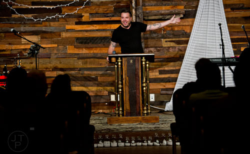 Pastor Josiah Potter (center) gives his sermon during worship service at Crosspointe Church in Peachtree City on Sunday, December 21, 2014. 