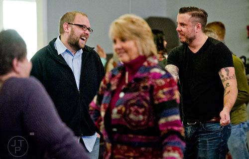 Pastor Josiah Potter (right) talks with Michael Nelson after Sunday worship service is concluded at Crosspointe Church in Peachtree City on Sunday, December 21, 2014. 