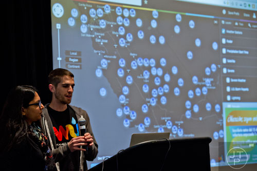 Sonali Pandey (left) and Sam Hiatt pitch their team's app to a panel of judges during The Weather Channel's Hack-A-Thon at the Atlanta Marriott Northwest at Galleria on Friday, December 12, 2014.