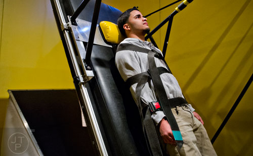 Jose Abdiel Santiago's facial expressions are recorded as he falls backwards in an interactive display in the Goosebumps: The Science of Fear exhibit at the Fernbank Museum of Natural History in Atlanta on Saturday, December 27, 2014.