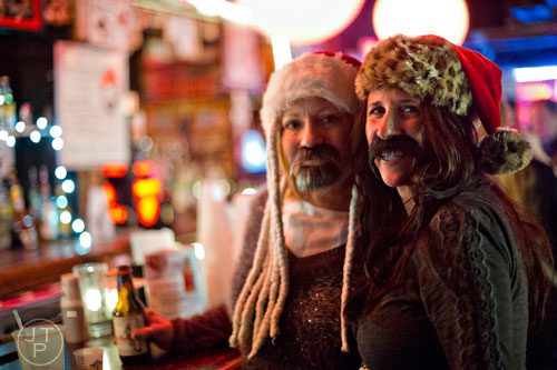 Tiffany Gillis (right) and Angi Brittain wait for the start of the 4th annual Battle of the Beards at Smith's Olde Bar in Atlanta on Saturday, December 13, 2014. 