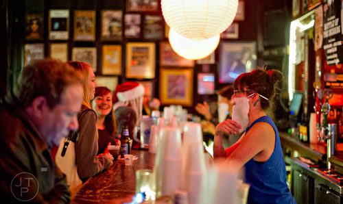 Hilary Irvine (right) serves drinks during 4th annual Battle of the Beards at Smith's Olde Bar in Atlanta on Saturday, December 13, 2014.
