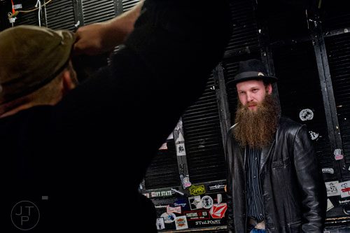 Mike Hawkins (right) has his photo taken by Josh Meister as he waits for the start of the 4th annual Battle of the Beards at Smith's Olde Bar in Atlanta on Saturday, December 13, 2014.