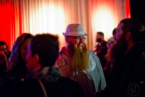 Seth Nixon (center) waits for the start of the 4th annual Battle of the Beards at Smith's Olde Bar in Atlanta on Saturday, December 13, 2014.